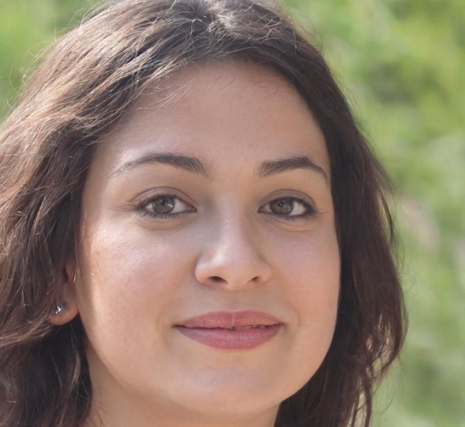 Linnea, founder and creative director of Lightwave Energy, working at her desk with design sketches