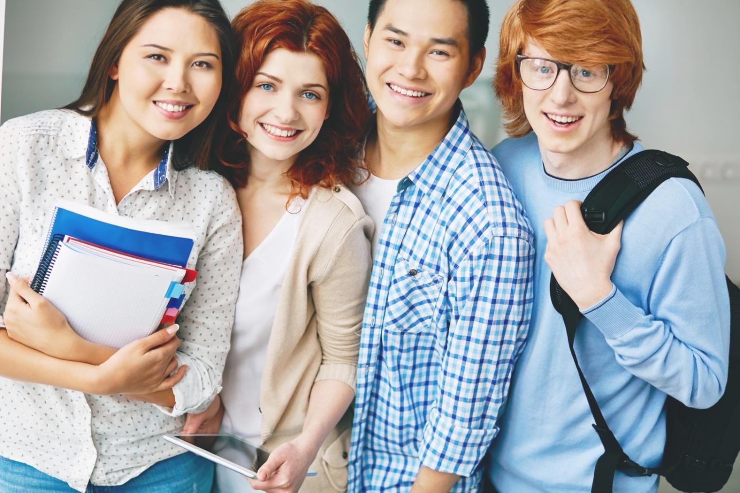 Modern workspace setup with dual monitors showing design mockups and user interface elements