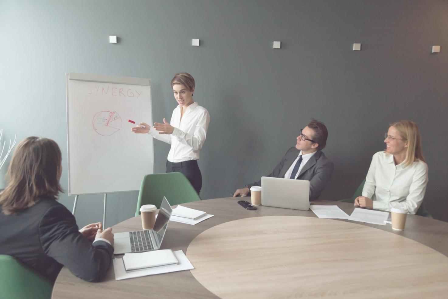 Team collaboration session with sticky notes and wireframes on office wall